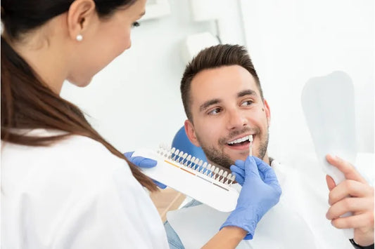 A person getting teeth whitening at the dentist's office