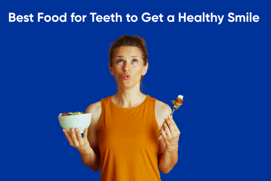 A girl holding a bowl of salad in one hand and a fork in the other, wondering what foods are best for a healthy smile. 