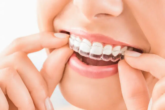 Smiling woman wearing an invisible aligner