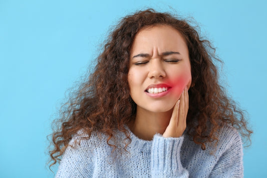 Woman suffering from tooth sensitivity